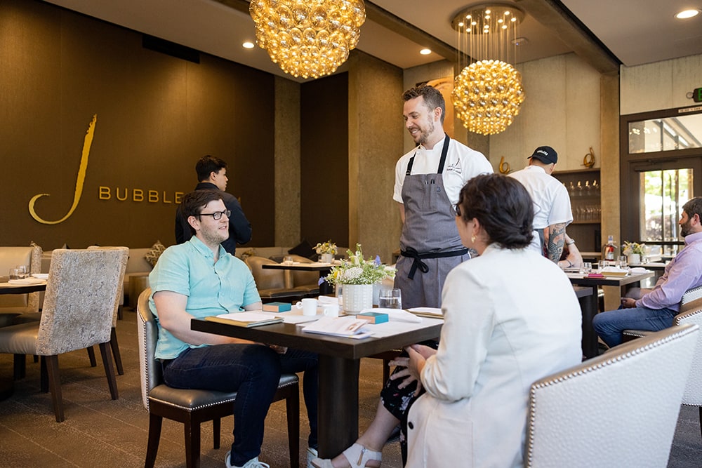 Customers being served at Bubble Room tasting