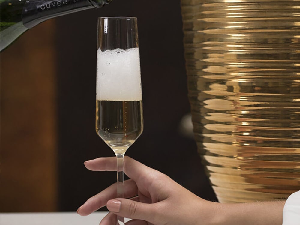 white wine being poured into glass