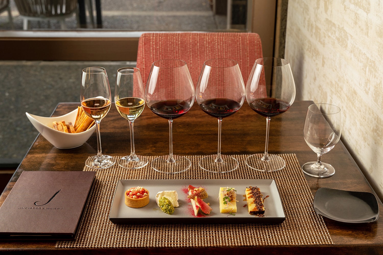 Tasting glasses and food laid out on table