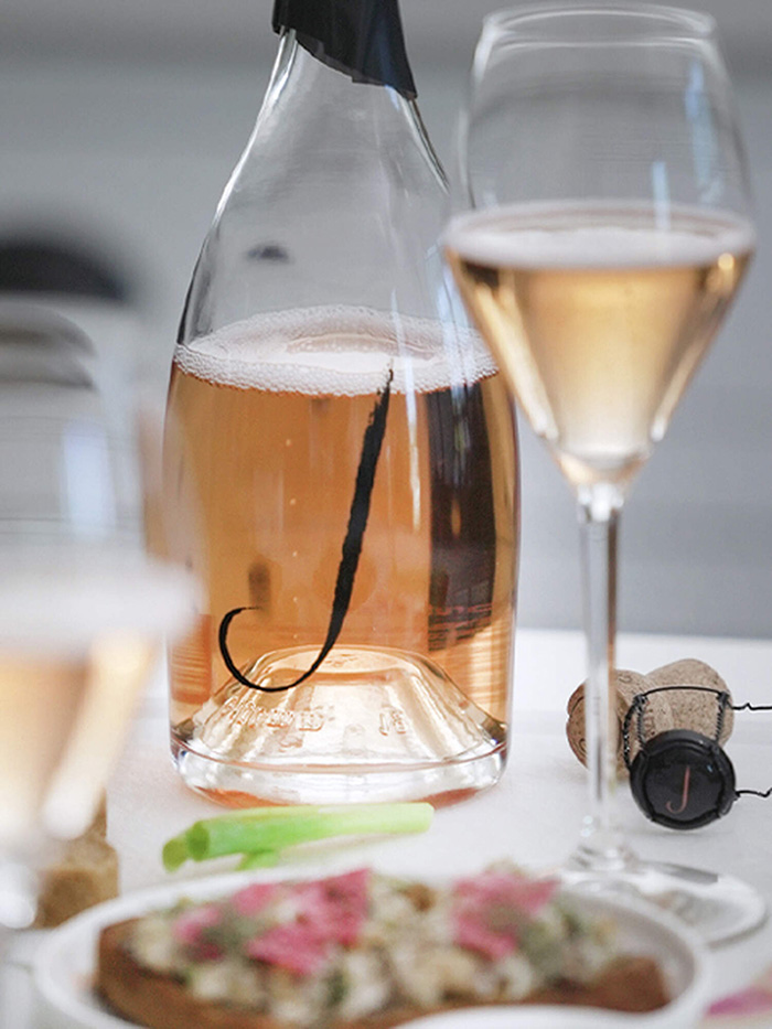 Bottle and glass of J Wine Rosé