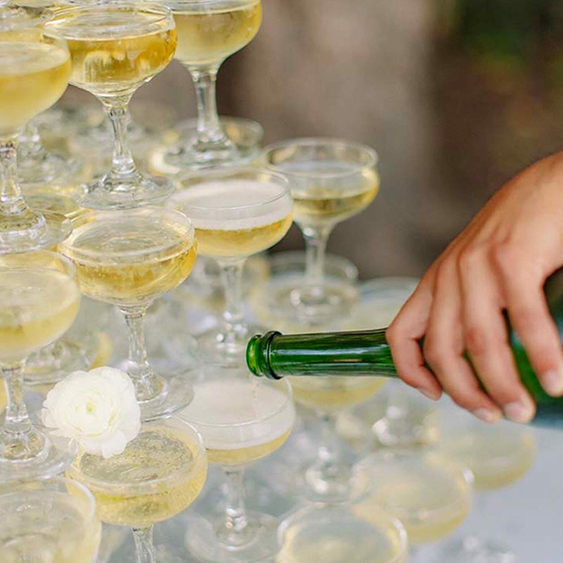 Sparkling wine being poured into cups